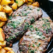 SKILLET GARLIC BUTTER HERB STEAK AND POTATOES